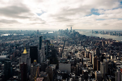 Aerial view of modern buildings in city against sky