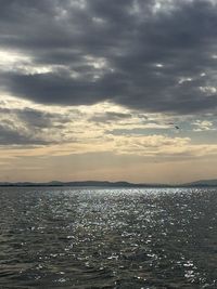 Scenic view of sea against cloudy sky