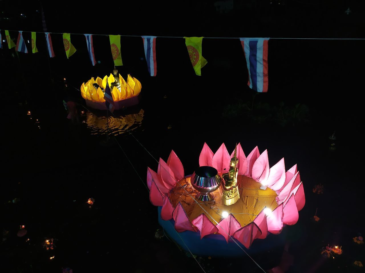 HIGH ANGLE VIEW OF MULTI COLORED UMBRELLAS ON FLOATING