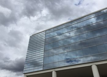 Reflection of clouds on glass building