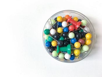 High angle view of colorful eggs against white background