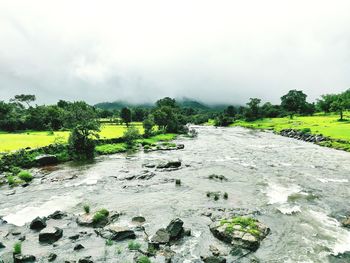 Scenic view of river against sky