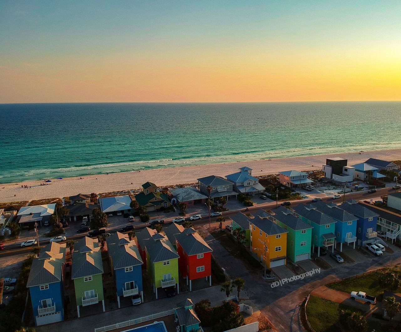 water, sea, sky, horizon, horizon over water, architecture, building exterior, built structure, high angle view, nature, scenics - nature, beauty in nature, sunset, land, no people, building, beach, city, clear sky, outdoors