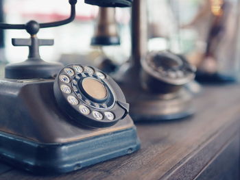 Close-up of telephone on table