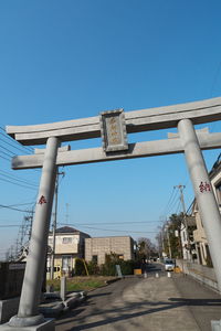 Low angle view of road against clear blue sky