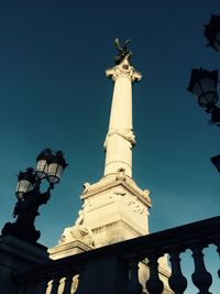 Low angle view of statue against sky