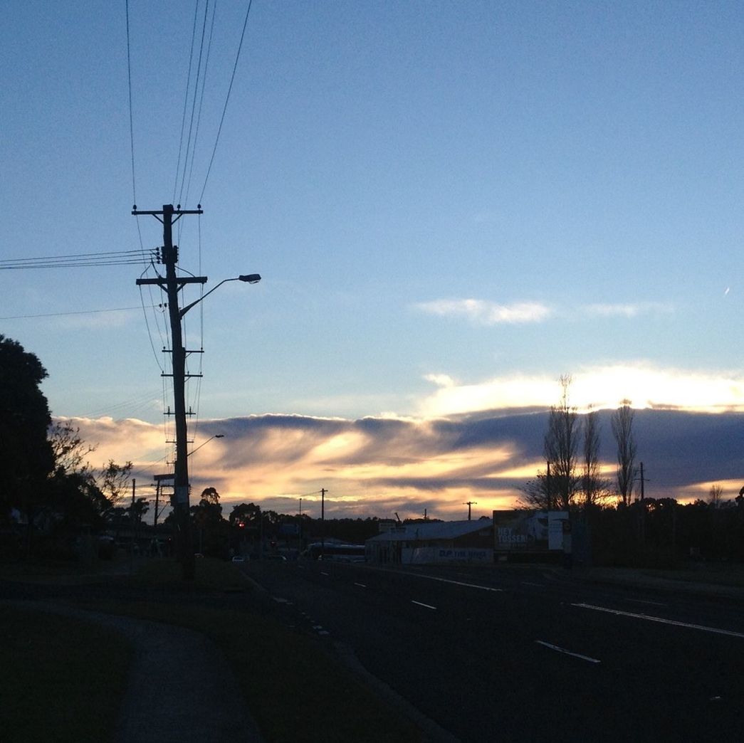 electricity pylon, power line, electricity, power supply, cable, fuel and power generation, sunset, sky, connection, silhouette, road, transportation, the way forward, power cable, technology, street, street light, outdoors, diminishing perspective, built structure