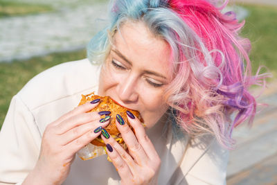 Portrait of woman holding ice cream