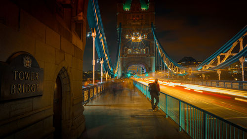 Illuminated bridge at night