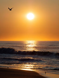 Scenic view of sunrise over the ocean