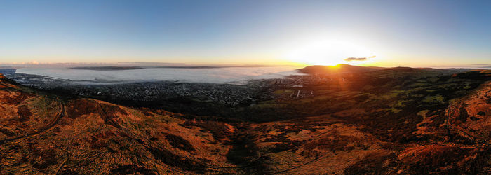 Scenic view of belfast, during low fog, against sky during sunset, taken from cavehill
