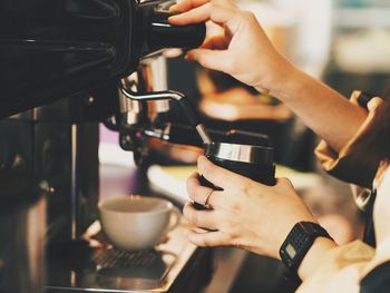 Close-up of woman taking coffee