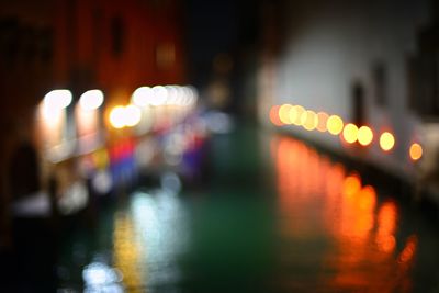 Defocused image of illuminated city at night