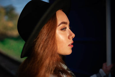 Portrait of a young woman in a hat