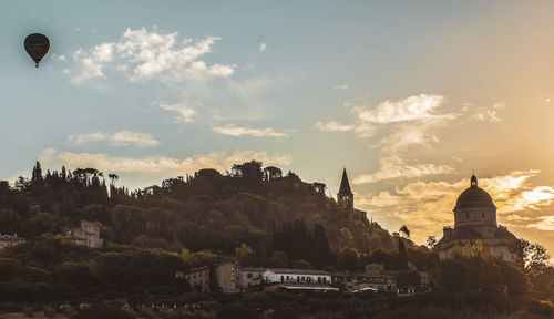 Low angle view of buildings against sky during sunset