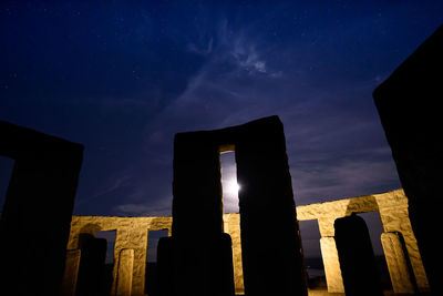 Low angle view of castle against sky at night