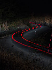 High angle view of light trails on road