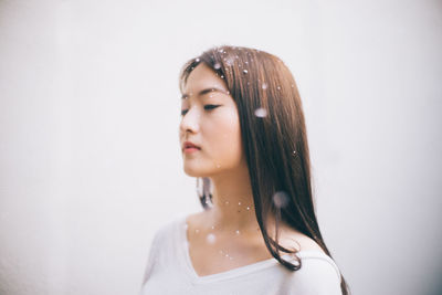 Young woman with water drops