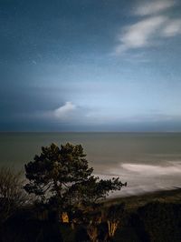 Scenic view of sea against sky at night