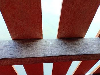 Low angle view of red wall against sky