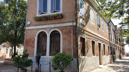 Low angle view of building by street