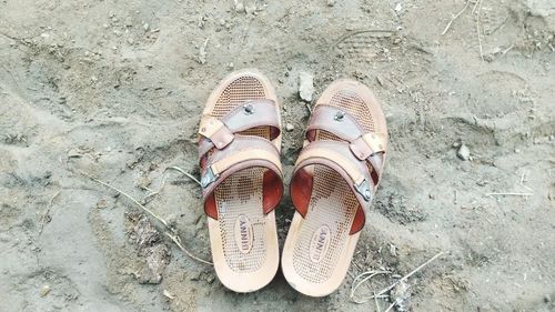 High angle view of shoes on sand