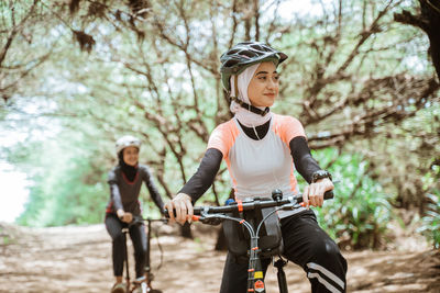 Portrait of woman riding bicycle