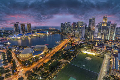 High angle view of illuminated buildings in city against sky