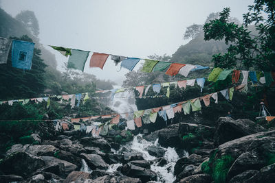 Scenic view of waterfall against sky