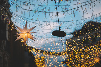 Low angle view of illuminated chandelier