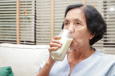 Portrait of man drinking glass