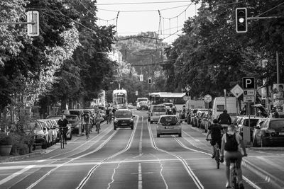 People walking on road in city