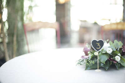 Close-up of flower vase on table