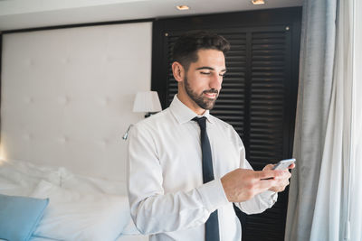 Young man using mobile phone