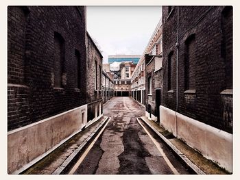 Narrow alley along buildings