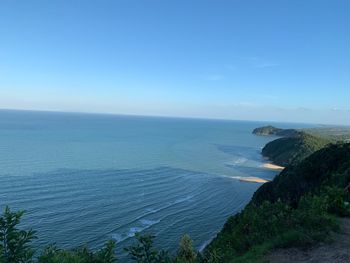 Scenic view of sea against blue sky