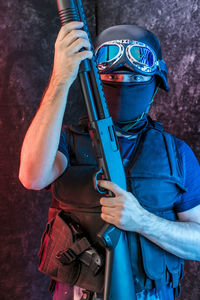 Counterterrorist with obscured face holding ak-47