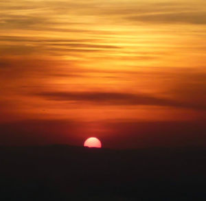 Scenic view of dramatic sky during sunset