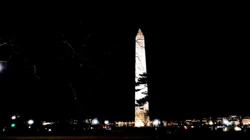 Low angle view of statue at night