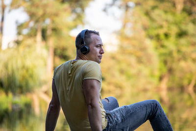 Side view of young man looking away