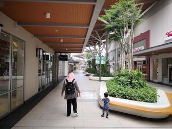 People walking in front of building