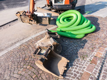 High angle view of painting on cobblestone street in city