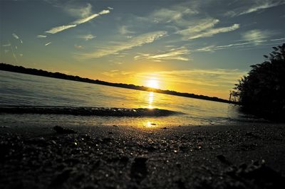 Scenic view of beach against sky during sunset