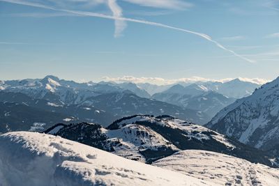 Scenic view of snowcapped mountains against sky