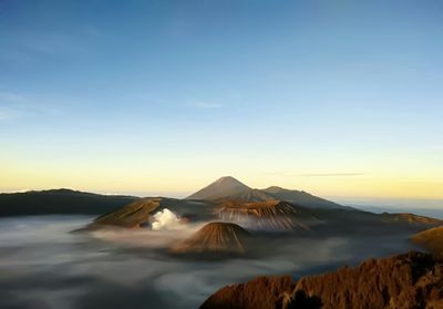 View of volcanic landscape against sky during sunset