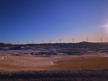 Scenic view of land against sky during sunset