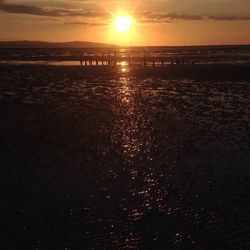 Scenic view of sea against sky at sunset