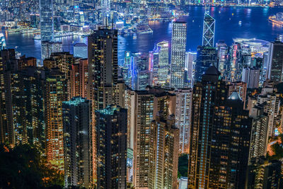 High angle view of illuminated city buildings at night