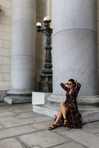 Portrait of woman sitting outdoors