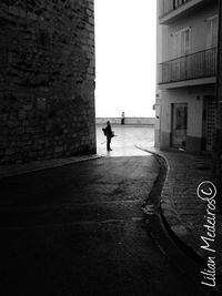 Woman walking on street in city